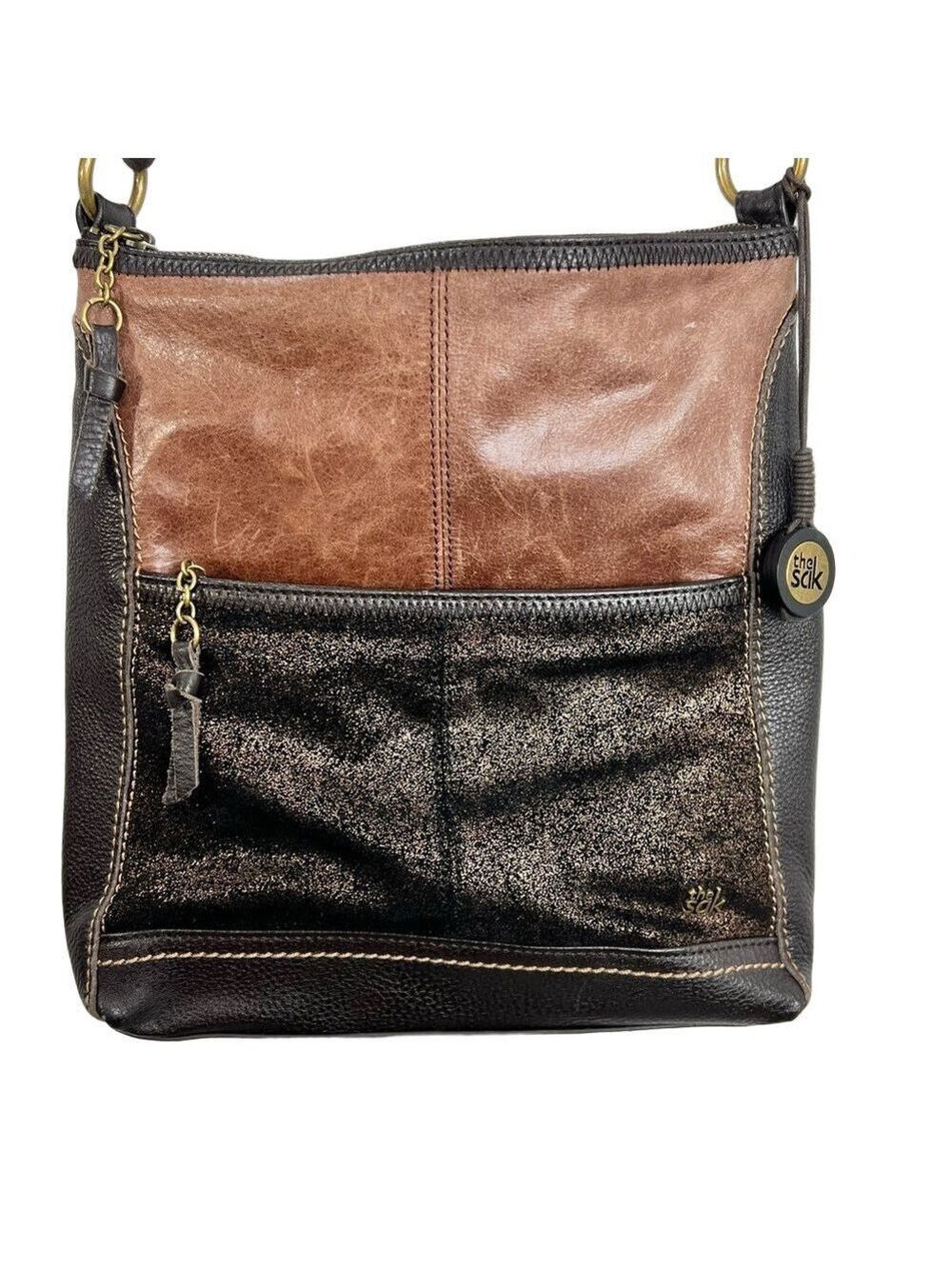 The SAK brown and metallic copper coated leather minimalist purse bag
